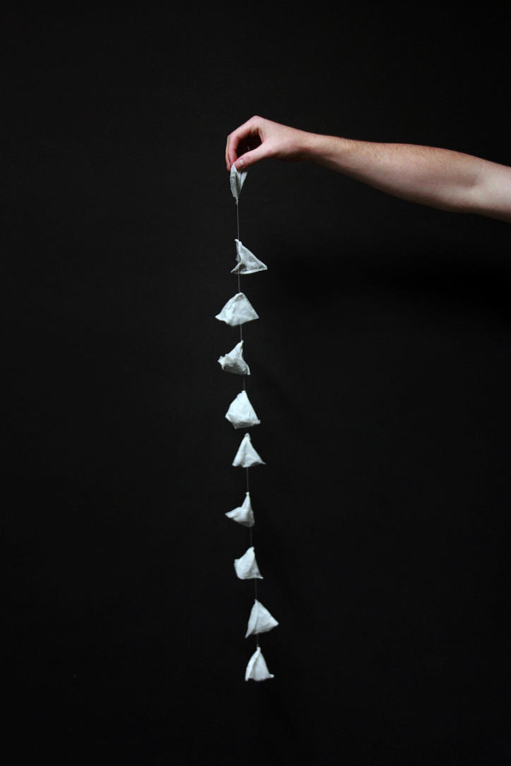Ten used teabags arranged in a grid, documenting a daily routine.